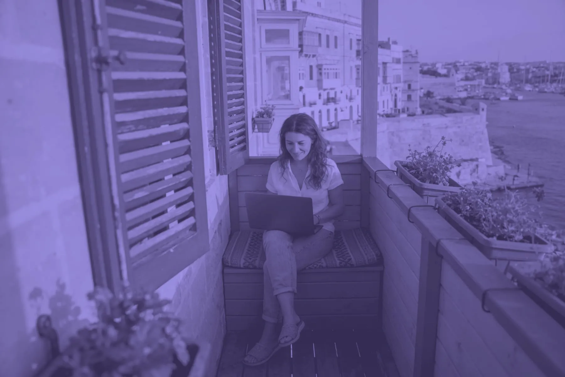 Someone working on a laptop in Malta