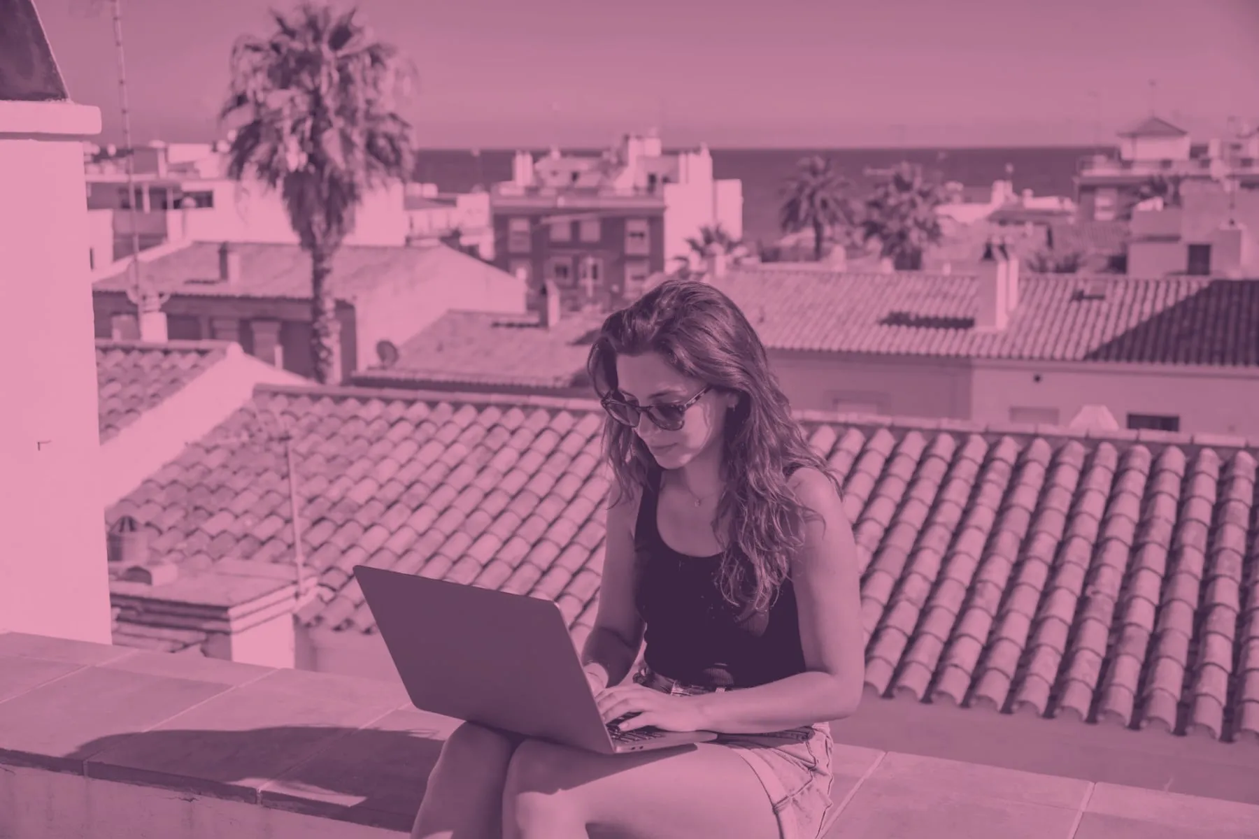 Someone working on a laptop in Spain
